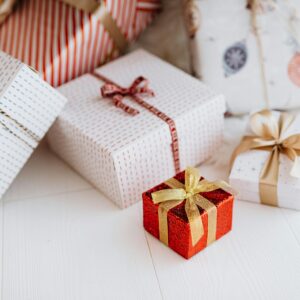 A collection of beautifully wrapped gift boxes with festive ribbons, perfect for holiday celebrations.